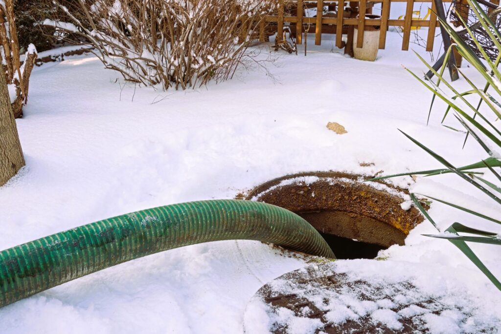 Pumping out a drain pit in winter
